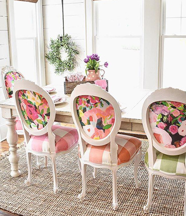 Farmhouse Dining Room With Colorful Patterned Chairs