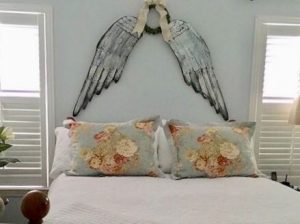 angel-wings-above-bed